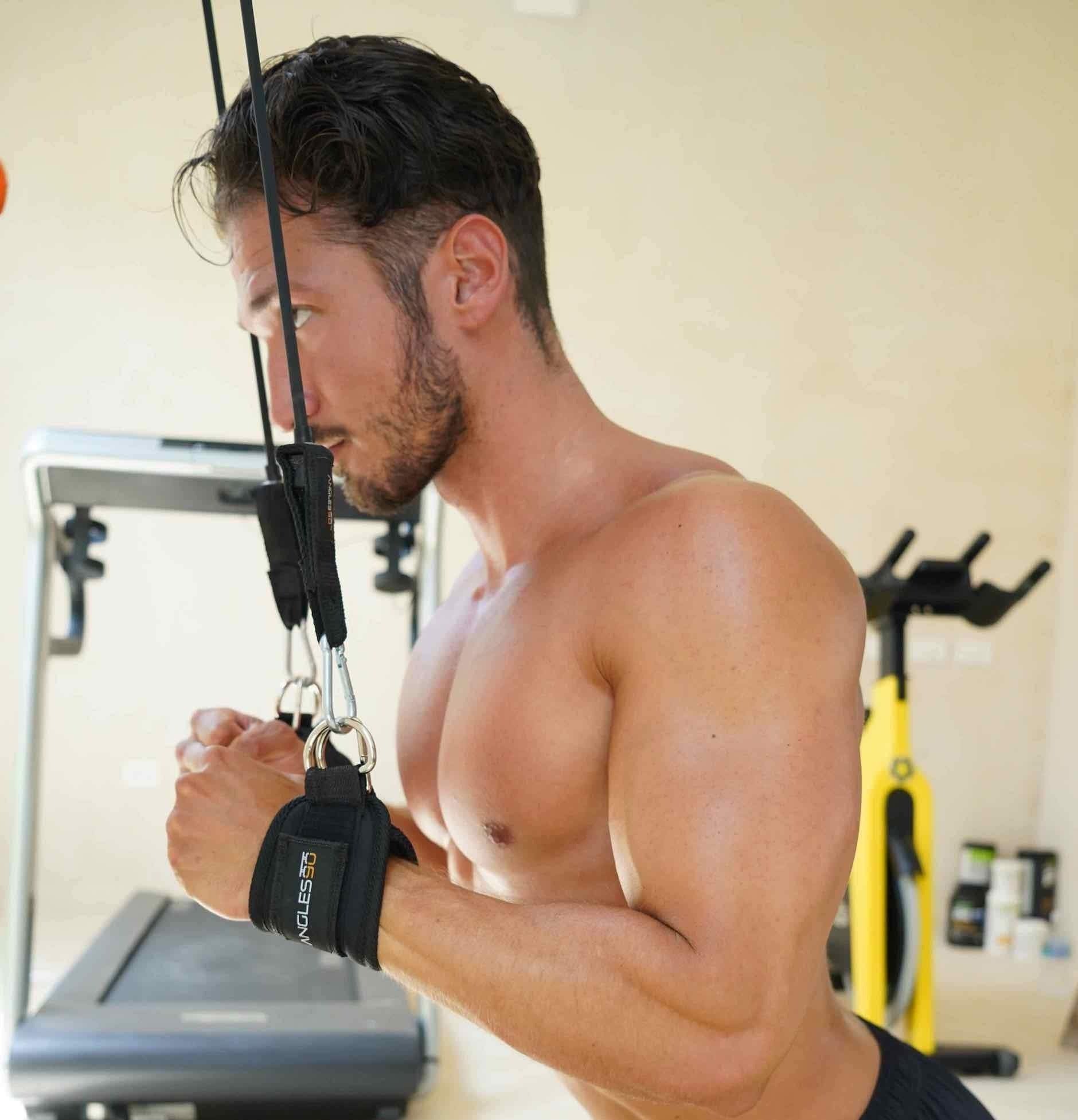 A focused man engaging in an intense resistance training workout using the A90 Leg Day Set at the gym.